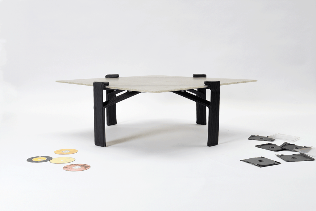 Coffee table made from recycled CDs turned into sheet material and 3D-printed legs