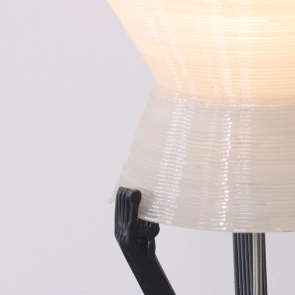 Standing lamp made from recycled CD cases and inlays close-up